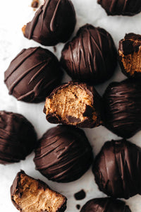 Yummy pumpkin cheesecake truffles with a rich dairy-free filling dipped in dark chocolate