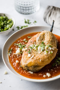 An authentic chile relleno recipe made from roasted poblano peppers stuffed with cheese, dipped in a fluffy egg batter and fried until golden brown! This traditional Mexican dish is fun to make and better than any restaurant version you’ll ever try!