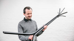 A simple coat stand with clear-cut contours