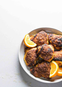 These orange ginger chicken thighs are an easy meal made by marinating chicken in a mixture of ginger, oranges, and soy sauce, then roasting to crispy-skinned perfection.