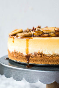 This creamy Bananas Foster Cheesecake is a decadent dessert that you can easily prepare in your own kitchen! A perfect cheesecake made from scratch is topped with a classic, sugary-sweet bananas foster sauce! I dare you to just have one slice!!