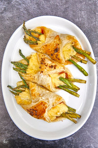 These Puff Pastry Bundles are filled with grilled asparagus, salami, smoked gouda, & garlic herb cheese spread and topped with Smoked Sea Salt Flake